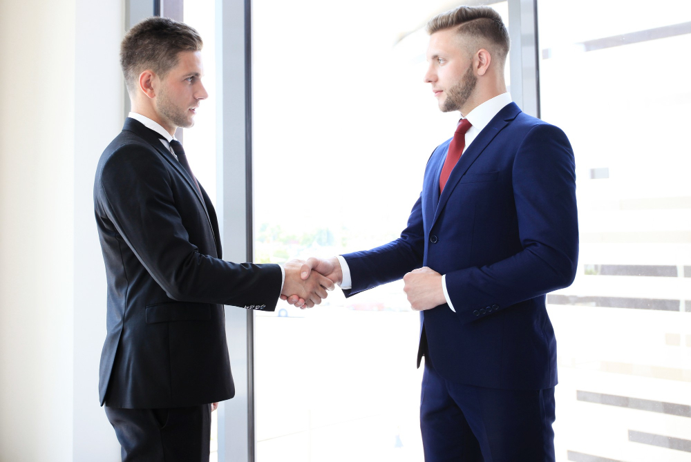 business-handshake-business-man-giving-a-handshake-to-close-the-deal.jpg