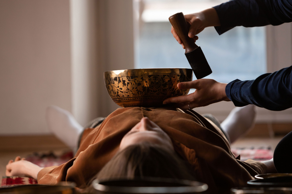 woman-making-relaxing-massage-meditation-sound-therapy-with-tibetian-singing-bowls.jpg