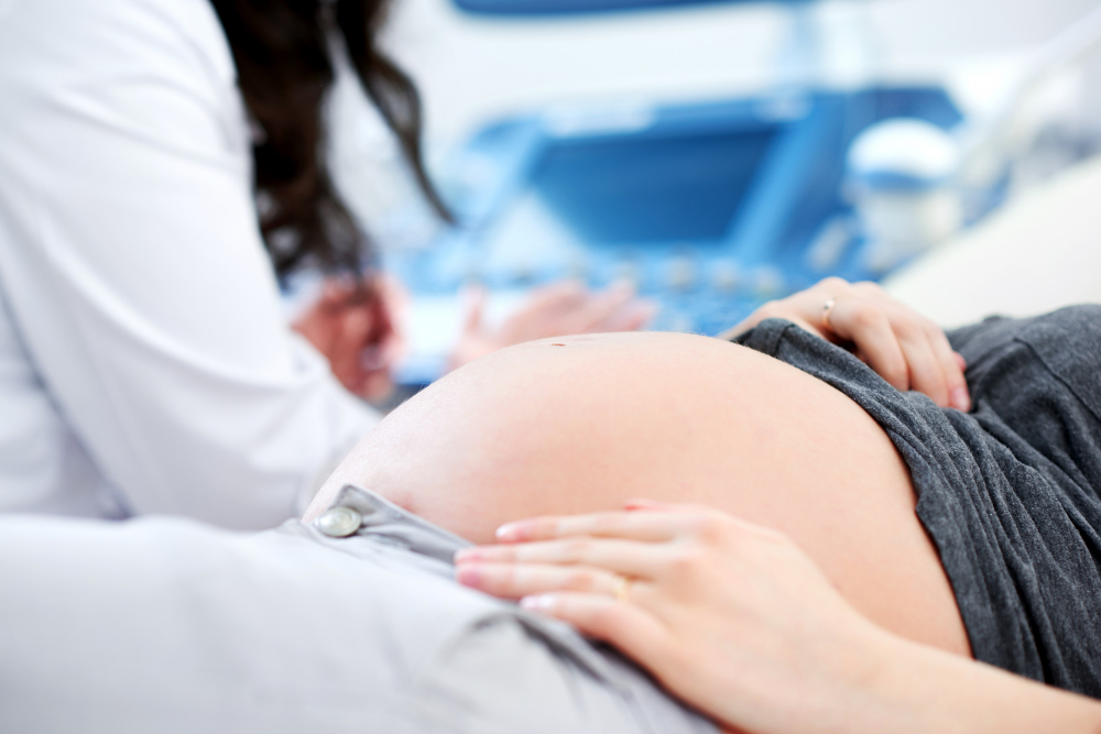 doctor-performing-ultrasound-scanning-for-her-pregnant-patient.jpg